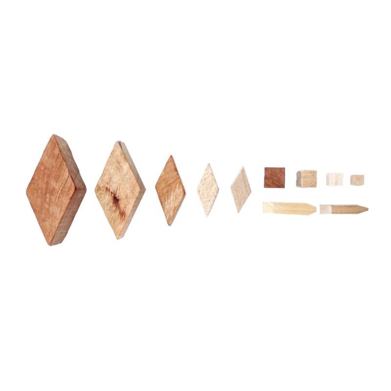 The image shows a set of wooden blocks on a white background. The blocks are arranged in a neat pattern and appear to be made of a light-colored wood. The background is a bright white, providing a sta