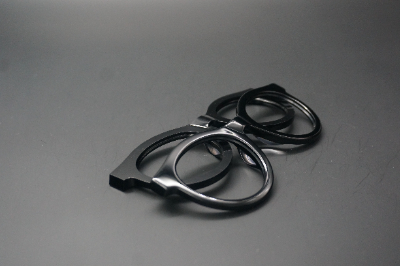 Black acetate eyeglass frames after controlled tumbling and polishing