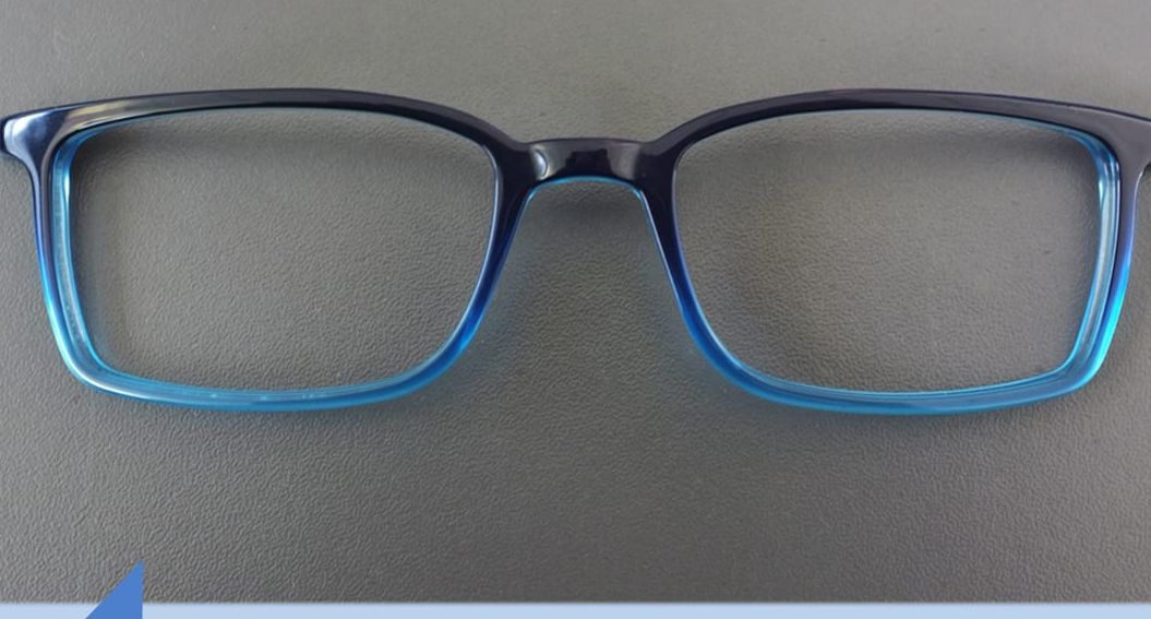 Blue acetate frame after tumbling stages showing smooth glossy surface